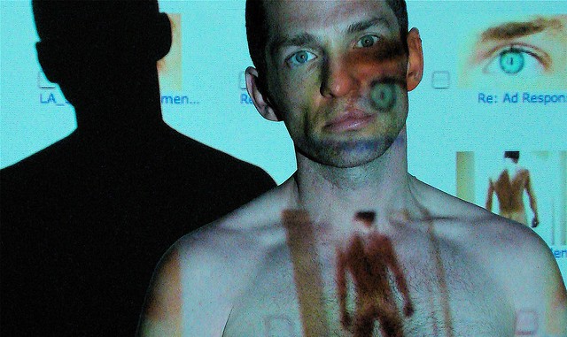 Still from the Skin I'm In with projection of a man's body on a man's face